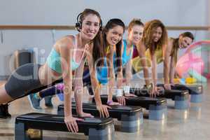 Group of women exercising on aerobic stepper