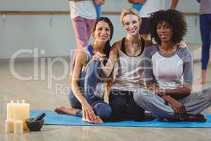 Women sitting on exercise mat