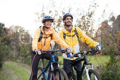 Biker couple cycling in countryside