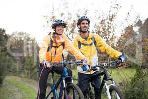 Biker couple cycling in countryside