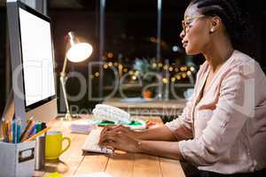 Businesswoman working on computer at her desk