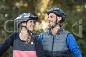 Biker couple smiling and looking at each other