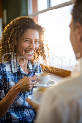 Couple having a cup of tea in super market