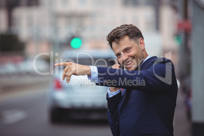 Handsome businessman talking on mobile phone