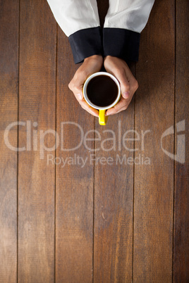 Woman holding a cup of coffee