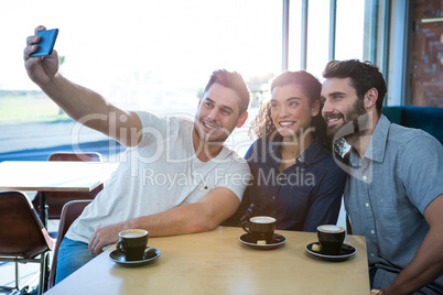Friends taking a selfie in the coffee shop