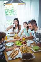 Happy family having breakfast together