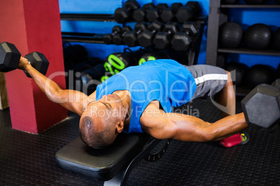 Man exercising with dumbbells