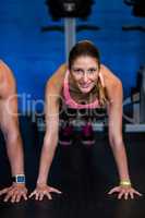 Young female athlete doing push-ups