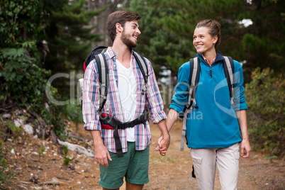 Hiker couple hiking in forest