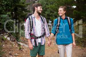 Hiker couple hiking in forest