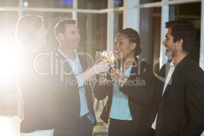 Group of businesspeople toasting glasses of champagne