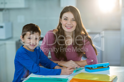 Mother helping her son with homework