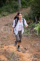 Female hiker walking in forest