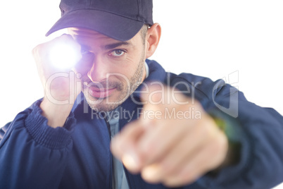Security officer holding a torch