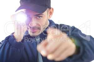 Security officer holding a torch