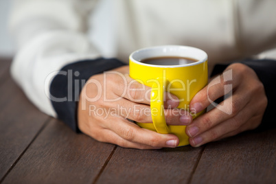 Woman holding a cup of coffee