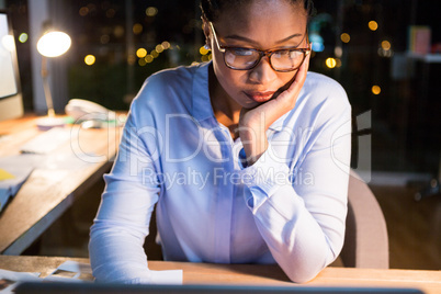 Businesswoman sitting at her desk