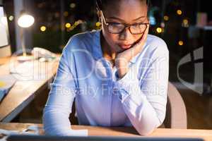 Businesswoman sitting at her desk