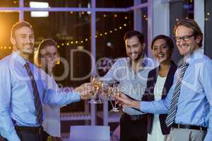 Businesspeople toasting glasses of champagne