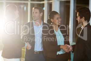 Group of businesspeople shaking hands with each other