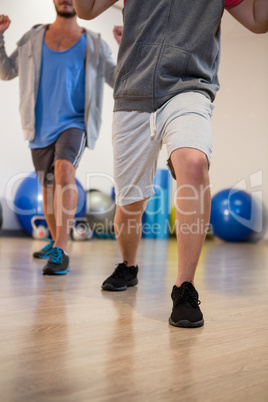 Men performing stretching exercise