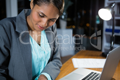 Businesswoman working on laptop