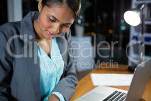 Businesswoman working on laptop