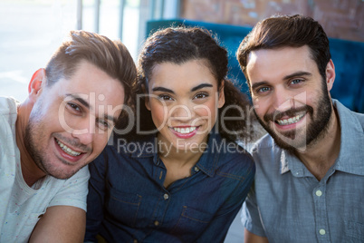 Portrait of three smiling friends