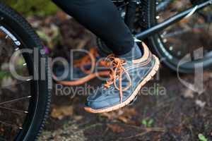 Low section of male biker with mountain bike