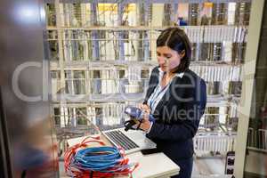 Technician using digital cable analyzer