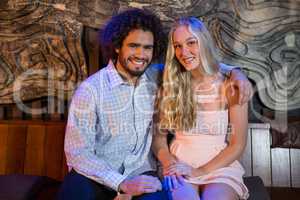 Couple sitting together in bar