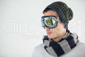 Man in winter clothing wearing aviator goggles