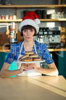 Waitress holding a tray of doughnuts