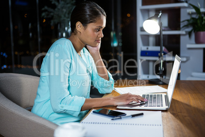 Businesswoman working on laptop
