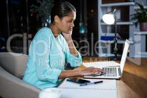 Businesswoman working on laptop