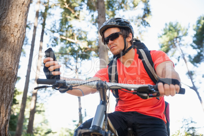 Mountain biker using mobile phone