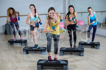 Group of women exercising on aerobic stepper