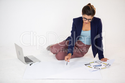 Businesswoman preparing a chart with icons