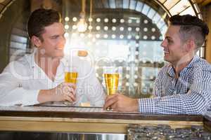 Two men having a glass of beer