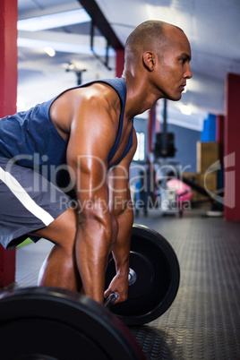 Male athlete lifting barbell