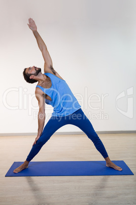 Man doing extended triangle pose