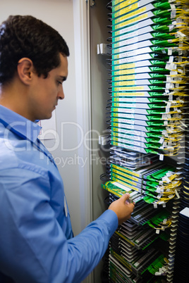 Technician checking routers