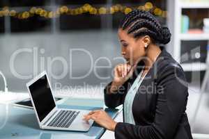 Businesswoman working on laptop