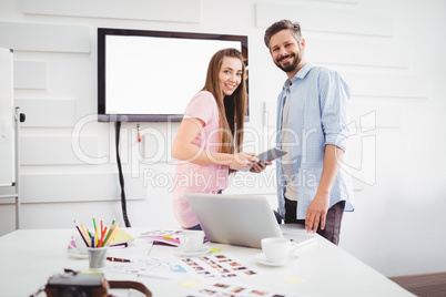 Portrait of editors with digital tablet at creative office