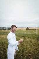 Agronomist checking the crops in the field