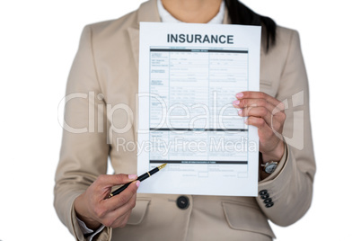 Mid section of businesswoman showing insurance contract