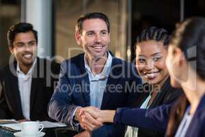 Businessman shaking hands with colleague