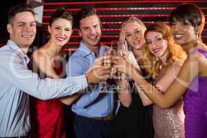 Group of friends toasting glasses of champagne