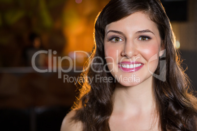 Smiling young woman in bar